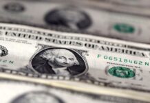 Dólar abre em queda, com novos ataques entre Israel e Irã no radar